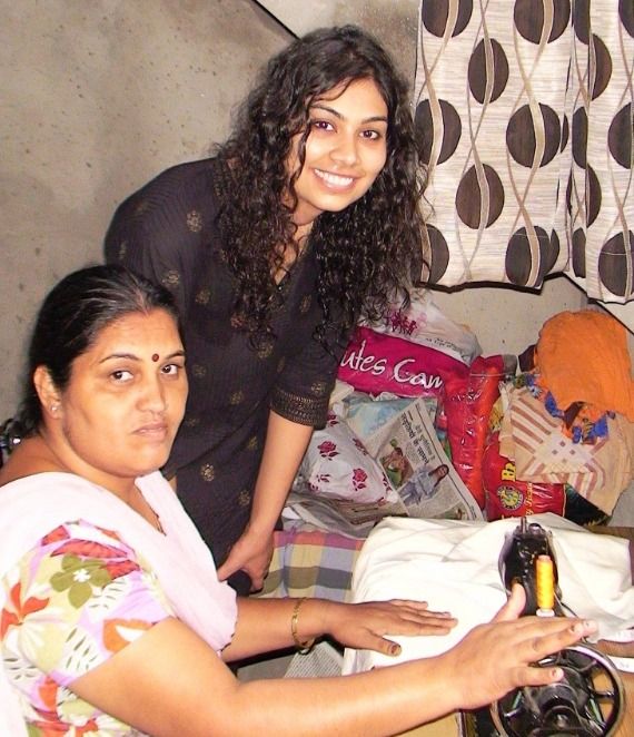 Founder with women at the sewing machines